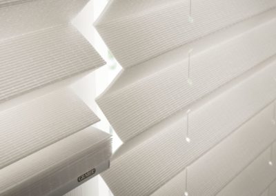 Close-up of white Graber pleated shades